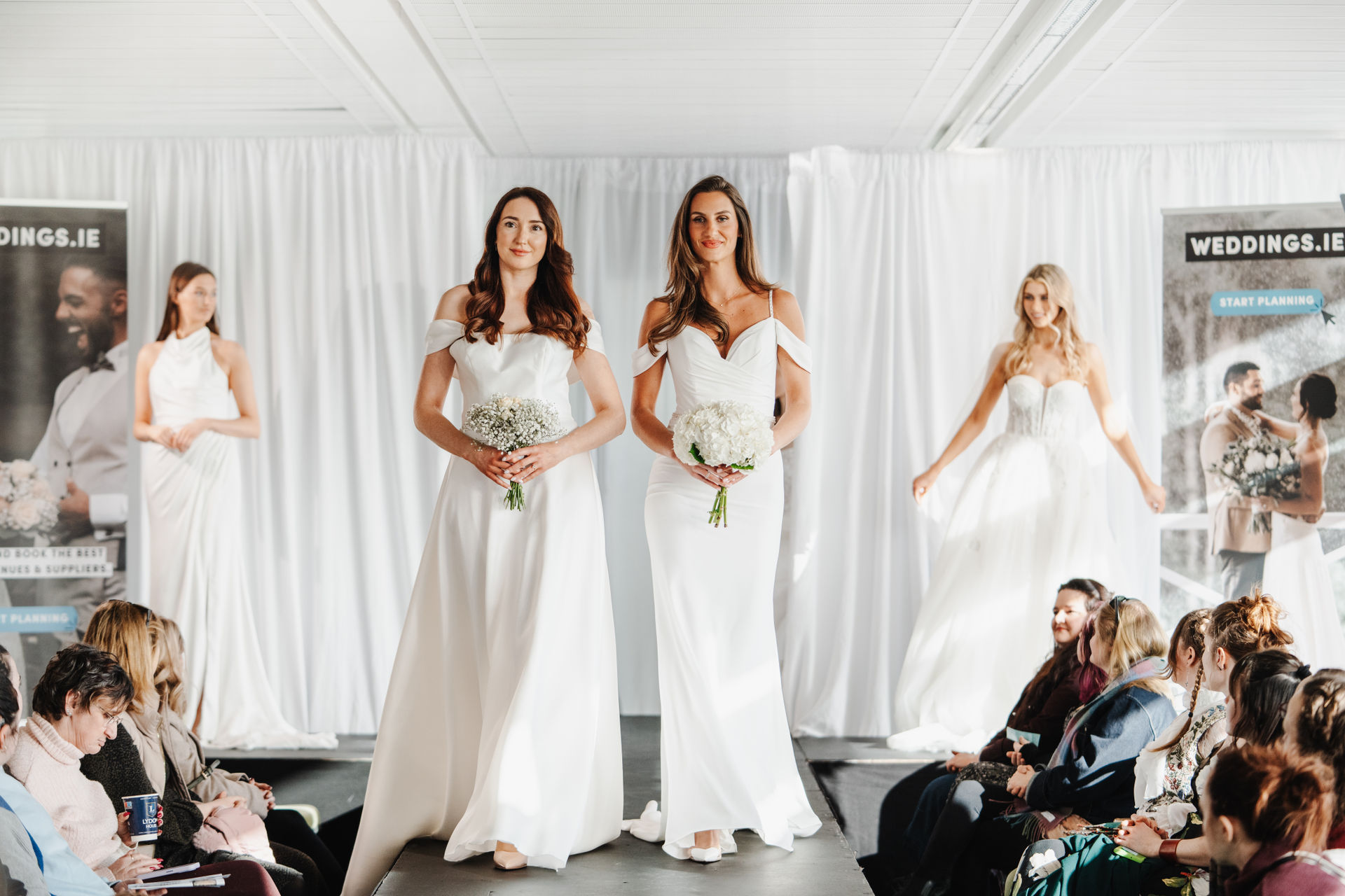 Bridal models on the Wedfest runway with bouquets