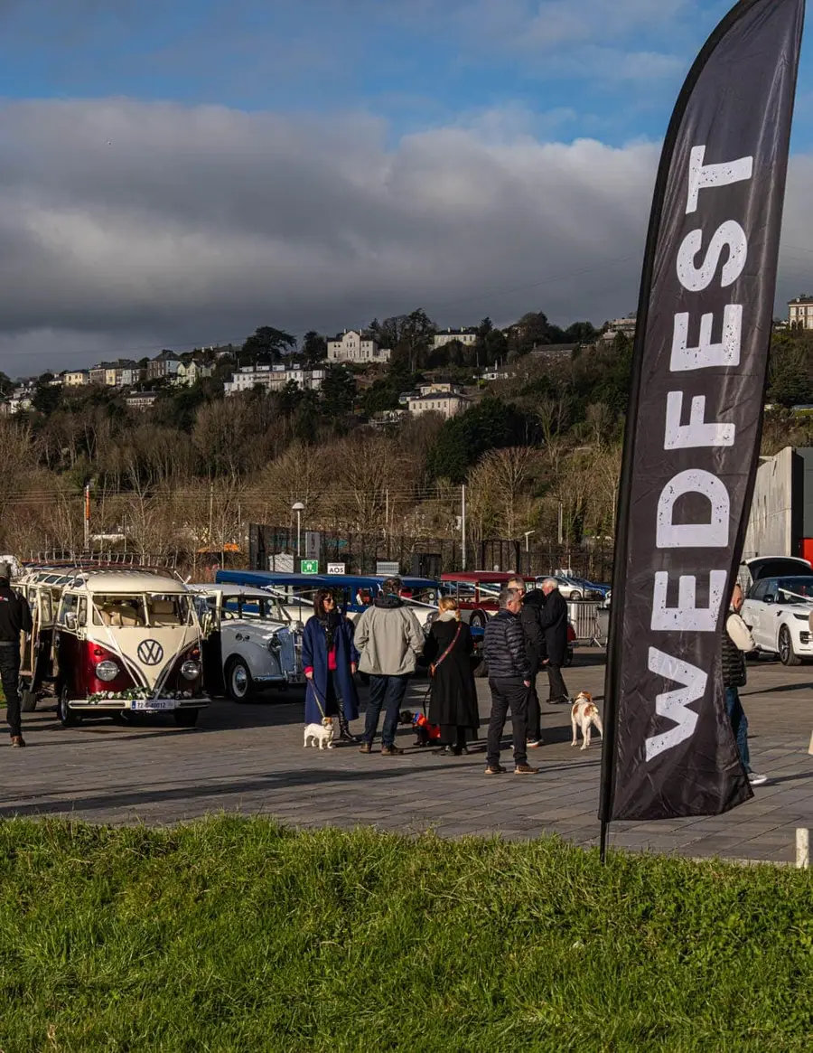 Wedfest flag and vintage wedding cars outside the venue